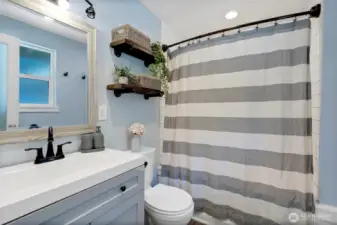 Ensuite primary bath with shower tub.