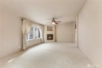 Here is 2nd entry view of large family room with cozy propane gas fireplace and lots of new light carpeting to enjoy
