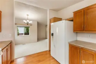 Kitchen view of good sized dining eating area off kitchen and front of home