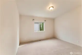 View of good sized second bedroom with new carpets and high ceilings also