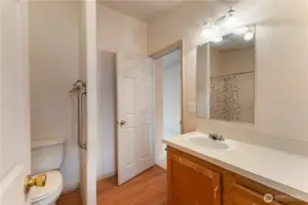 2nd bathroom view with door to office bonus room and kitchen