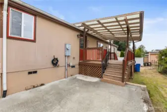 Side entry of home with easy parking access looking toward back yard