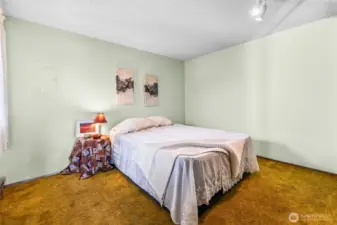 This is a Queen-size bed. A King should fit fine.