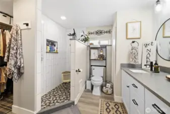 Custom bathroom with walk in shower and his and hers closets