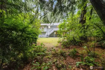 The greenbelt and the large yard offer privacy behind the house.