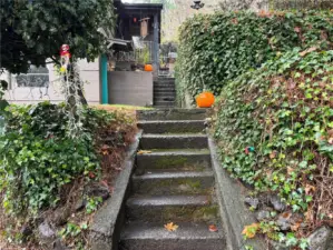 Up the stairs to the lower unit and then a fenced area with stairs to the upper unit.