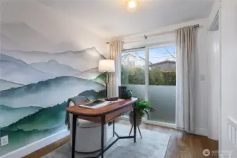 Lower level bedroom with closet, en suite bathroom with shower and privacy sliders to fenced green space and patio