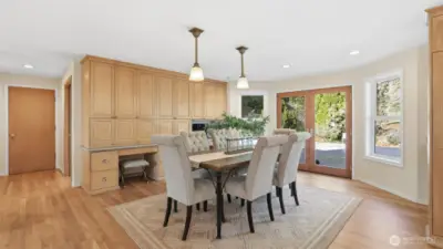 Dining room features custom built-ins with desk areas.