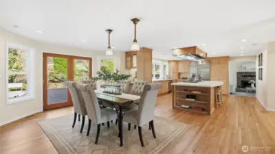 Oversized French doors lead to the large backyard patio. Refinished hardwood floors, fresh interior paint