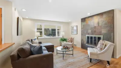 Family room features exquisite slate surround lending modern charm and architectural detail.