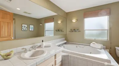 Upstairs hall bath with large soaking tub and shower.