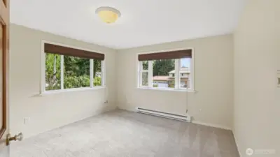 Another secondary upstairs bedroom with new carpet and plenty of light.