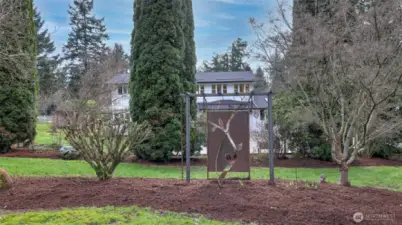 Extensive grounds include apple, cherry, pear, and peach trees.