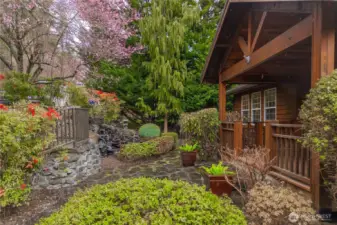 Relax on your front porch enjoying the beautiful landscaping throughout the seasons.