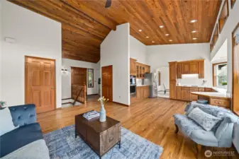 Enter to the warmth of a welcoming home with tongue and grove vaulted ceilings and natural wood accentuated millwork.