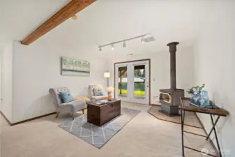 Warm up during the winter months with a woodstove or enjoy quick access to the backyard in the lower level bonus room.