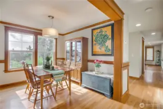 The sun-drenched formal dining room showcases sweeping southern territorial views.