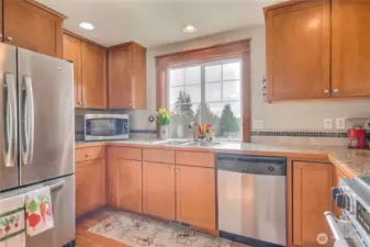 The kitchen features stainless steel appliances.