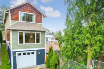 Large one-car garage with storage and additional off-street parking.