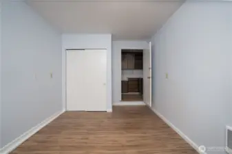 This bedroom offers access to a nearby bathroom with a shower.