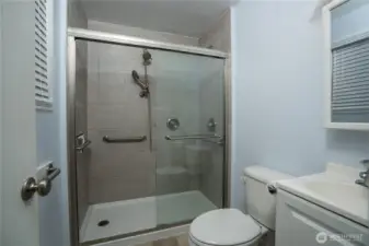 Enjoy a tiled shower in the primary bathroom, adding style and elegance.