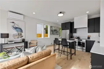 The eat-in kitchen flows seamlessly into the main living area