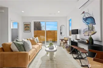 Main living space with sliding doors to the patio and backyard