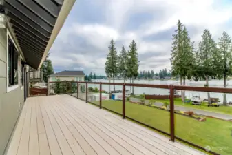 Deck off kitchen with views of Lake Tapps and Mt. Rainier. Double sliding doors and stairs to lower level patio and terrace