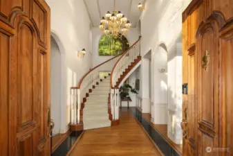 Stunning Curved staircase greets you as you enter