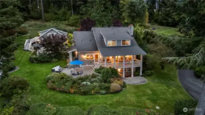 Inviting home with gardens, outbuildings,  and apartment above garage