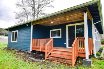 Back covered deck of main home overlooking backyard