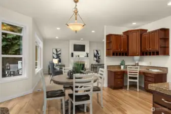 Open concept kitchen with quality cabinetry and bonus workspace.