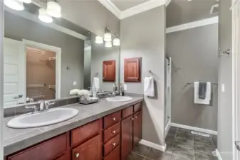 Double vanities and a walk in closet in primary bath.