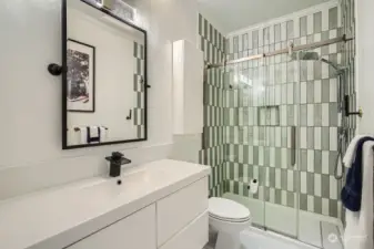 Guest bath is freshly renovated and is located just off entry foyer, adjacent to the bedroom