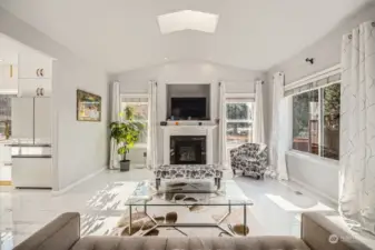 Light and bright vaulted ceiling living room flows directly to the kitchen and allows extensive natural light from skylights plus south and east facing windows