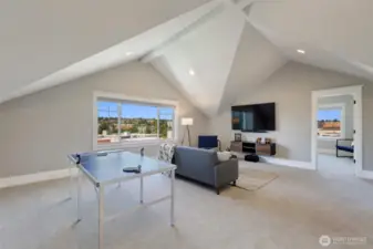 Third floor is a great room or recreational space bookend with two bedrooms on either side.