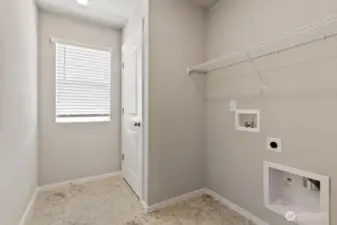 Convenient laundry room on upper level. Colors, finishes, and options will vary.