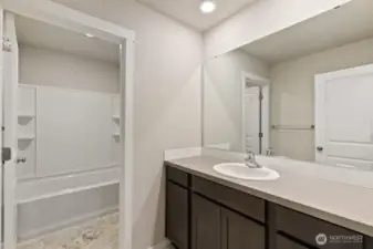 Hall bathroom on upper level; Colors, finishes, and options will vary.
