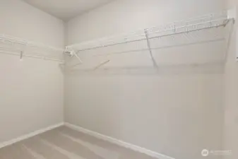 Primary walk-in closet; Colors, finishes, and options will vary.