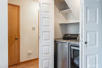 Laundry is tucked away behind double doors