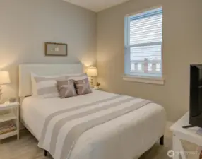 Queen size bed and large windows.