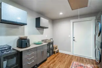 Laundry room with new stackable washer and dryer