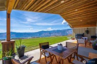 Natural wood cover over spacious patio area