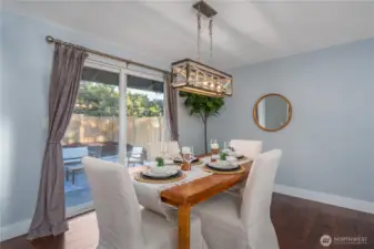 This dining area can be casual or elegant, with direct access to the patio and fully fenced backyard.