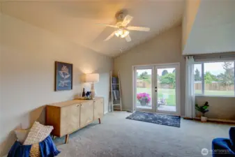Great room with vaulted ceiling, french doors to the backyard.