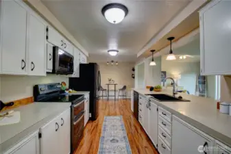 Kitchen looking from pantry area to breakfast area.  Lots of counterspace.