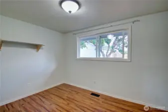 3rd bedroom off of the front hall facing the backyard.