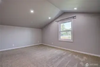 Upper bonus room with closet above laundry area.  Short ladder and stair access.