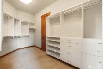 Primary closet with custom organization.