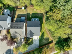 Aerial view of property overhead. Tranquil greenbelt surrounds the property.